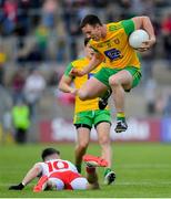 8 June 2019; Leo McLoone of Donegal in action against Matthew Donnelly of Tyrone during the Ulster GAA Football Senior Championship semi-final match between Donegal and Tyrone at Kingspan Breffni Park in Cavan. Photo by Ramsey Cardy/Sportsfile