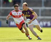 8 June 2019; James Cash of Wexford in action against Niall Keenan of Derry during the GAA Football All-Ireland Senior Championship Round 1 match between Wexford and Derry at Innovate Wexford Park in Wexford. Photo by Matt Browne/Sportsfile