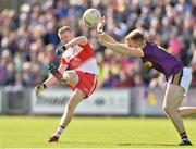 8 June 2019; Christopher Bradley of Derry in action against James Cash of Wexford during the GAA Football All-Ireland Senior Championship Round 1 match between Wexford and Derry at Innovate Wexford Park in Wexford. Photo by Matt Browne/Sportsfile