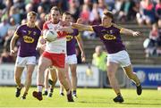 8 June 2019; Ryan Bell of Derry in action against Eoin Porter of Wexford during the GAA Football All-Ireland Senior Championship Round 1 match between Wexford and Derry at Innovate Wexford Park in Wexford. Photo by Matt Browne/Sportsfile