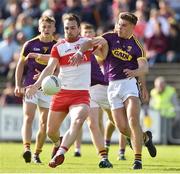 8 June 2019; Ryan Bell of Derry in action against Eoin Porter of Wexford during the GAA Football All-Ireland Senior Championship Round 1 match between Wexford and Derry at Innovate Wexford Park in Wexford. Photo by Matt Browne/Sportsfile