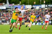 8 June 2019; Ryan McHugh of Donegal in action against Niall Sludden of Tyrone during the Ulster GAA Football Senior Championship semi-final match between Donegal and Tyrone at Kingspan Breffni Park in Cavan. Photo by Ramsey Cardy/Sportsfile