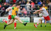 8 June 2019; Jamie Brennan of Donegal has a shot at goal blocked by Matthew Donnelly of Tyrone during the Ulster GAA Football Senior Championship semi-final match between Donegal and Tyrone at Kingspan Breffni Park in Cavan. Photo by Ramsey Cardy/Sportsfile