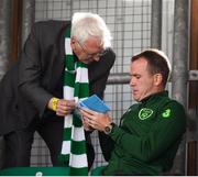 8 June 2019; Republic of Ireland international Glenn Whelan signs an autograph during the SSE Airtricity League Premier Division match between Shamrock Rovers and Derry City at Tallaght Stadium in Dublin. Photo by Stephen McCarthy/Sportsfile