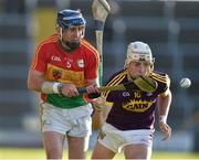 8 June 2019; Eoin Nolan of Carlow in action against Rory O'Connor of Wexford during the Leinster GAA Hurling Senior Championship Round 4 match between Wexford and Carlow at Innovate Wexford Park in Wexford. Photo by Matt Browne/Sportsfile