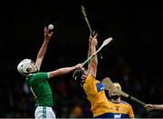 9 June 2019; Diarmuid Hegarty of Limerick in action against Jarlath Collins of Clare during the Electric Ireland Munster Minor Hurling Championship match between Limerick and Clare at the LIT Gaelic Grounds in Limerick. Photo by Diarmuid Greene/Sportsfile