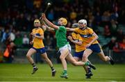 9 June 2019; Cathal O'Neill of Limerick in action against Cian Galvin of Clare during the Electric Ireland Munster Minor Hurling Championship match between Limerick and Clare at the LIT Gaelic Grounds in Limerick. Photo by Diarmuid Greene/Sportsfile