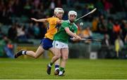 9 June 2019; Cian Casey of Limerick in action against Oisin Clune of Clare during the Electric Ireland Munster Minor Hurling Championship match between Limerick and Clare at the LIT Gaelic Grounds in Limerick. Photo by Diarmuid Greene/Sportsfile