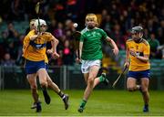 9 June 2019; Cathal O'Neill of Limerick in action against Cian Galvin, left, and Jarlath Collins of Clare during the Electric Ireland Munster Minor Hurling Championship match between Limerick and Clare at the LIT Gaelic Grounds in Limerick. Photo by Diarmuid Greene/Sportsfile