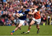 9 June 2019; Dara McVeety of Cavan in action against Paddy Burns of Armagh during the Ulster GAA Football Senior Championship Semi-Final Replay match between Cavan and Armagh at St Tiarnach's Park in Clones, Monaghan. Photo by Oliver McVeigh/Sportsfile