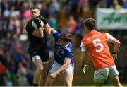 9 June 2019; Blaine Hughes of Armagh taking the ball in the air against Oisin Pierson of Cavan during the Ulster GAA Football Senior Championship Semi-Final Replay match between Cavan and Armagh at St Tiarnach's Park in Clones, Monaghan. Photo by Oliver McVeigh/Sportsfile