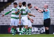 14 June 2019; Shamrock Rovers players, from left, Dylan Watts, Ethan Boyle, Roberto Lopes and Greg Bolger remonstrate with referee Robert Rogers after awarding Bohemians a second penalty during the SSE Airtricity League Premier Division match between Bohemians and Shamrock Rovers at Dalymount Park in Dublin. Photo by Ben McShane/Sportsfile