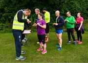 15 June 2019; Volunteers are pictured as they scan participants' barcodes at the Griffeen parkrun where Vhi hosted a special Roadshow event to celebrate their partnership with parkrun Ireland. Vhi ambassador and Olympian David Gillick was on hand to lead the warm up for parkrun participants before completing the 5km free event. Parkrunners enjoyed refreshments post event at the Vhi Rehydrate, Relax, Refuel and Reward areas where a physiotherapist took participants through a post event stretching routine. Parkrun in partnership with Vhi support local communities in organising free, weekly, timed 5k runs every Saturday at 9.30am. To register for a parkrun near you visit www.parkrun.ie.  Photo by Seb Daly/Sportsfile
