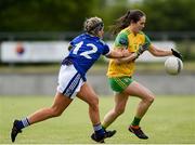 15 June 2019; Katy Herron of Donegal in action against Donna English of Cavan during the TG4 Ladies Football Ulster Senior Football Championship semi-final match between Cavan and Donegal at Killyclogher in Tyrone. Photo by Oliver McVeigh/Sportsfile