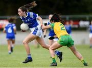 15 June 2019; Neasa Byrd of Cavan in action against Anna Marie McGlynn of Donegal  during the TG4 Ladies Football Ulster Senior Football Championship semi-final match between Cavan and Donegal at Killyclogher in Tyrone. Photo by Oliver McVeigh/Sportsfile