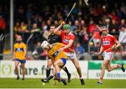 16 June 2019; Oisin Clune of Clare in action against Luke Horgan of Cork during the Electric Ireland Munster Minor Hurling Championship match between Clare and Cork at Cusack Park in Ennis, Clare. Photo by Eóin Noonan/Sportsfile