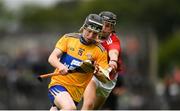 16 June 2019; Diarmuid Cahill of Clare in action against Cian McCarthy of Cork during the Electric Ireland Munster Minor Hurling Championship match between Clare and Cork at Cusack Park in Ennis, Clare. Photo by Eóin Noonan/Sportsfile