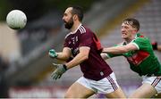 16 June 2019; Eddie O'Sullivan Galway in action against Michael McGarry of Mayo during the Connacht GAA Football Junior Championship Final match between Galway and Mayo at Pearse Stadium in Galway. Photo by Ramsey Cardy/Sportsfile