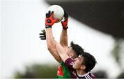 16 June 2019; Barry Duffy of Mayo in action against Thomas Gleeson of Galway during the Connacht GAA Football Junior Championship Final match between Galway and Mayo at Pearse Stadium in Galway. Photo by Ramsey Cardy/Sportsfile