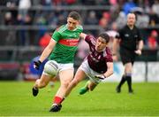 16 June 2019; Conor Igoe of Mayo in action against Padraic Éoin Ó Currin of Galway during the Connacht GAA Football Junior Championship Final match between Galway and Mayo at Pearse Stadium in Galway. Photo by Seb Daly/Sportsfile