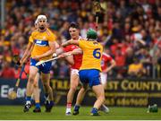 16 June 2019; Aidan Walsh of Cork scores a point despite the attention of Jack Browne of Clare during the Munster GAA Hurling Senior Championship Round 5 match between Clare and Cork at Cusack Park in Ennis, Clare. Photo by Eóin Noonan/Sportsfile