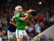 16 June 2019; Cian Lynch of Limerick scores the last point of the game under pressure from Noel McGrath of Tipperary during the Munster GAA Hurling Senior Championship Round 5 match between Tipperary and Limerick in Semple Stadium in Thurles, Tipperary. Photo by Ray McManus/Sportsfile