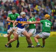 16 June 2019; Padraic Maher of Tipperary  in action against Conor Boylan, left, and Graeme Mulcahy and Tom Morrissey, 12, of Limerick during the Munster GAA Hurling Senior Championship Round 5 match between Tipperary and Limerick in Semple Stadium in Thurles, Tipperary. Photo by Ray McManus/Sportsfile