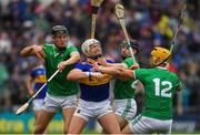 16 June 2019; Padraic Maher of Tipperary  in action against Conor Boylan, left, and Graeme Mulcahy and Tom Morrissey, 12, of Limerick during the Munster GAA Hurling Senior Championship Round 5 match between Tipperary and Limerick in Semple Stadium in Thurles, Tipperary. Photo by Ray McManus/Sportsfile