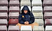 16 June 2019; A Galway supporter takes cover from the rain prior to the Connacht GAA Football Senior Championship Final match between Galway and Roscommon at Pearse Stadium in Galway. Photo by Seb Daly/Sportsfile