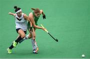 16 June 2019; Katie Mullan of Ireland in action against Lee Yuri of Korea during the FIH World Hockey Series Final match between Ireland and Korea at Banbridge Hockey Club in Banbridge, Down.  Photo by Oliver McVeigh/Sportsfile
