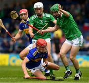 16 June 2019; Jack Leamy of Tipperary in action against Adam Murrihy, right, and Jimmy Quilty of Limerick during the Electric Ireland Munster GAA Minor Hurling Championship Round 5 match between Tipperary and Limerick in Semple Stadium in Thurles, Tipperary. Photo by Ray McManus/Sportsfile
