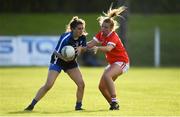 16 June 2019; Kellyann Hogan of Waterford in action against Saoirse Noonan of Cork during the TG4 Ladies Football Munster Senior Football Championship Final match between Cork and Waterford at Fraher Field in Dungarvan, Co. Waterford. Photo by Harry Murphy/Sportsfile