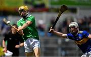 16 June 2019; Adam English of Limerick in action against Jamie Duncan of Tipperary during the Electric Ireland Munster GAA Minor Hurling Championship Round 5 match between Tipperary and Limerick in Semple Stadium in Thurles, Tipperary. Photo by Ray McManus/Sportsfile