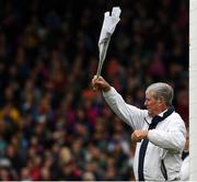 16 June 2019; An umpire waves a white flag to indicate a point had been scored during the Munster GAA Hurling Senior Championship Round 5 match between Tipperary and Limerick at Semple Stadium in Thurles, Tipperary. Photo by Ray McManus/Sportsfile