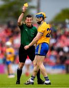 16 June 2019; Referee Paud O'Dwyer shows a yellow card to Seadna Morey of Clare during the Munster GAA Hurling Senior Championship Round 5 match between Clare and Cork at Cusack Park in Ennis, Clare. Photo by Eóin Noonan/Sportsfile