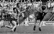 3 July 1983; Colm O'Rourke of Meath has a shot on goal despite the best efforts of Gerry Hargan and goalkeeper John O'Leary of Dublin. Leinster Senior Football Championship quarter-final replay, Meath v Dublin in Croke Park in Dublin. Photo by Ray McManus/Sportsfile.