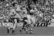 12 June 1983; Colm O'Rourke of Meath is tackled by Mick Kennedy of Dublin. Leinster Senior Football Championship quarter-final, Dublin v Meath in Croke Park in Dublin. Photo by Ray McManus/Sportsfile.