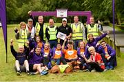 22 June 2019; Vhi ambassador and Olympian David Gillick was on hand to lead the warm up for parkrun participants before completing the 5km free event. Parkrunners enjoyed refreshments post event at the Vhi Rehydrate, Relax, Refuel and Reward areas. Parkrun in partnership with Vhi support local communities in organising free, weekly, timed 5k runs every Saturday at 9.30am. To register for a parkrun near you visit www.parkrun.ie. Pictured at the Templemore parkrun where Vhi hosted a special event to celebrate their partnership with parkrun Ireland are volunteers along with Vhi ambassador David Gillick and Simba the dog. Photo by Diarmuid Greene/Sportsfile