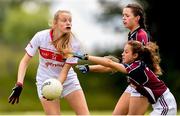 22 June 2019; Tara Hickey of Cork in action against Neasa Daly of Galway during the Ladies Football All-Ireland U14 Platinum Final 2019 match between Cork and Galway at St Rynaghs in Banagher, Offaly. Photo by Ben McShane/Sportsfile