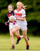 22 June 2019; Katie O'Driscoll of Cork in action against Gráinne Molloy of Galway during the Ladies Football All-Ireland U14 Platinum Final 2019 match between Cork and Galway at St Rynaghs in Banagher, Offaly. Photo by Ben McShane/Sportsfile