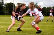 22 June 2019; Aoife Nash of Galway evades the tackle of Ciara Morrisson of Cork during the Ladies Football All-Ireland U14 Platinum Final 2019 match between Cork and Galway at St Rynaghs in Banagher, Offaly. Photo by Ben McShane/Sportsfile