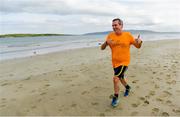 22 June 2019; Parkrun Ireland in partnership with Vhi, added a new parkrun at Narin Beach on Saturday 22nd June, with the introduction of the Narin parkrun on Narin Beach in Portnoo, Donegal. Parkruns take place over a 5km course weekly, are free to enter and are open to all ages and abilities, providing a fun and safe environment to enjoy exercise. To register for a parkrun near you visit www.parkrun.ie. Pictured is Eoin Fegan during the parkrun. Photo by Ramsey Cardy/Sportsfile