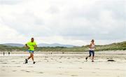 22 June 2019; Parkrun Ireland in partnership with Vhi, added a new parkrun at Narin Beach on Saturday 22nd June, with the introduction of the Narin parkrun on Narin Beach in Portnoo, Donegal. Parkruns take place over a 5km course weekly, are free to enter and are open to all ages and abilities, providing a fun and safe environment to enjoy exercise. To register for a parkrun near you visit www.parkrun.ie. Pictured is participants during the parkrun. Photo by Ramsey Cardy/Sportsfile