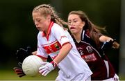 22 June 2019; Eabha Curran of Cork in action against Shiofra Ni Scanlain of Galway during the Ladies Football All-Ireland U14 Platinum Final 2019 match between Cork and Galway at St Rynaghs in Banagher, Offaly. Photo by Ben McShane/Sportsfile