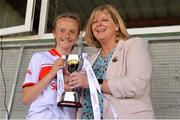22 June 2019; Cork captain Millie Condon is presented the cup by LGFA President Marie Hickey following the Ladies Football All-Ireland U14 Platinum Final 2019 match between Cork and Galway at St Rynaghs in Banagher, Offaly. Photo by Ben McShane/Sportsfile