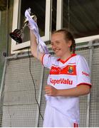 22 June 2019; Cork captain Millie Condon lifts the cup following the Ladies Football All-Ireland U14 Platinum Final 2019 match between Cork and Galway at St Rynaghs in Banagher, Offaly. Photo by Ben McShane/Sportsfile