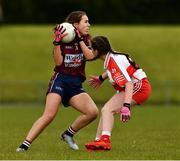 22 June 2019; Aine Ditullio of Westmeath  in action against Eva Ferguson of Derry during the Ladies Football All-Ireland U14 Bronze Final 2019 match between Derry and Westmeath at St Aidan's GAA Club in Templeport, Cavan. Photo by Ray McManus/Sportsfile