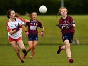 22 June 2019; Emer Fogarty of Westmeath in action against Sarah Heron of Derry during the Ladies Football All-Ireland U14 Bronze Final 2019 match between Derry and Westmeath at St Aidan's GAA Club in Templeport, Cavan. Photo by Ray McManus/Sportsfile