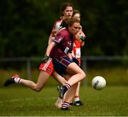 22 June 2019; Sadhbh Gorman of Westmeath kicks the second goal under pressure from Kate Harkin of Derry during the Ladies Football All-Ireland U14 Bronze Final 2019 match between Derry and Westmeath at St Aidan's GAA Club in Templeport, Cavan. Photo by Ray McManus/Sportsfile