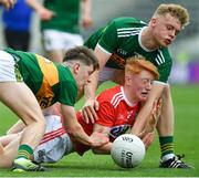 22 June 2019; Jack Cahalane of Cork is tackled by Luke Chester and Alan Dineen of Kerry during the Electric Ireland Munster GAA Football Minor Championship Final match between Cork and Kerry at Páirc Ui Chaoimh in Cork.  Photo by Brendan Moran/Sportsfile